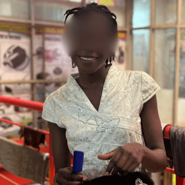 girl smiles while styling hair